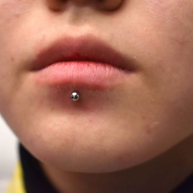 Close-up of a lip piercing